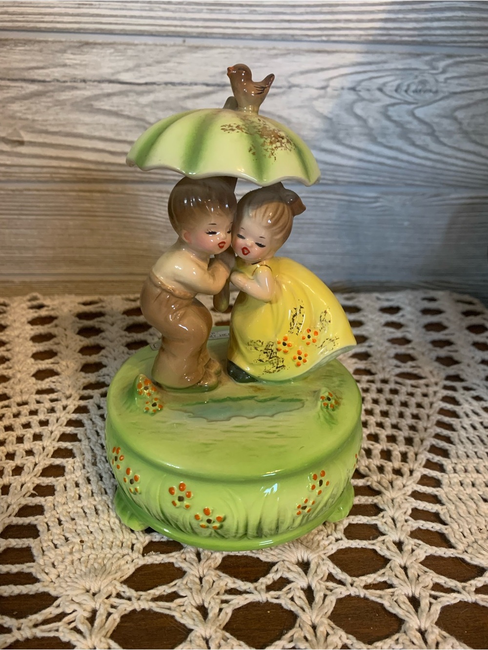 Vintage Josef Original Music box. Boy and girl under umbrella. Plays “Rain drops